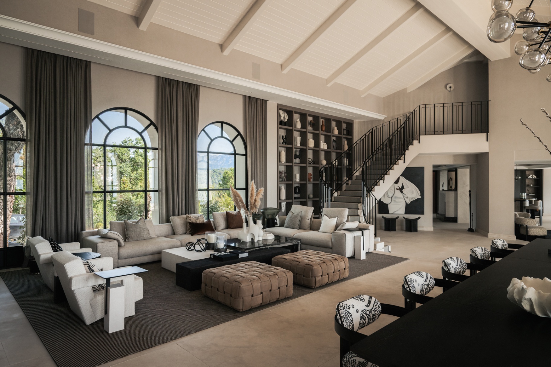 The main salon at Casa Servetta with vaulted ceilings and arched windows.