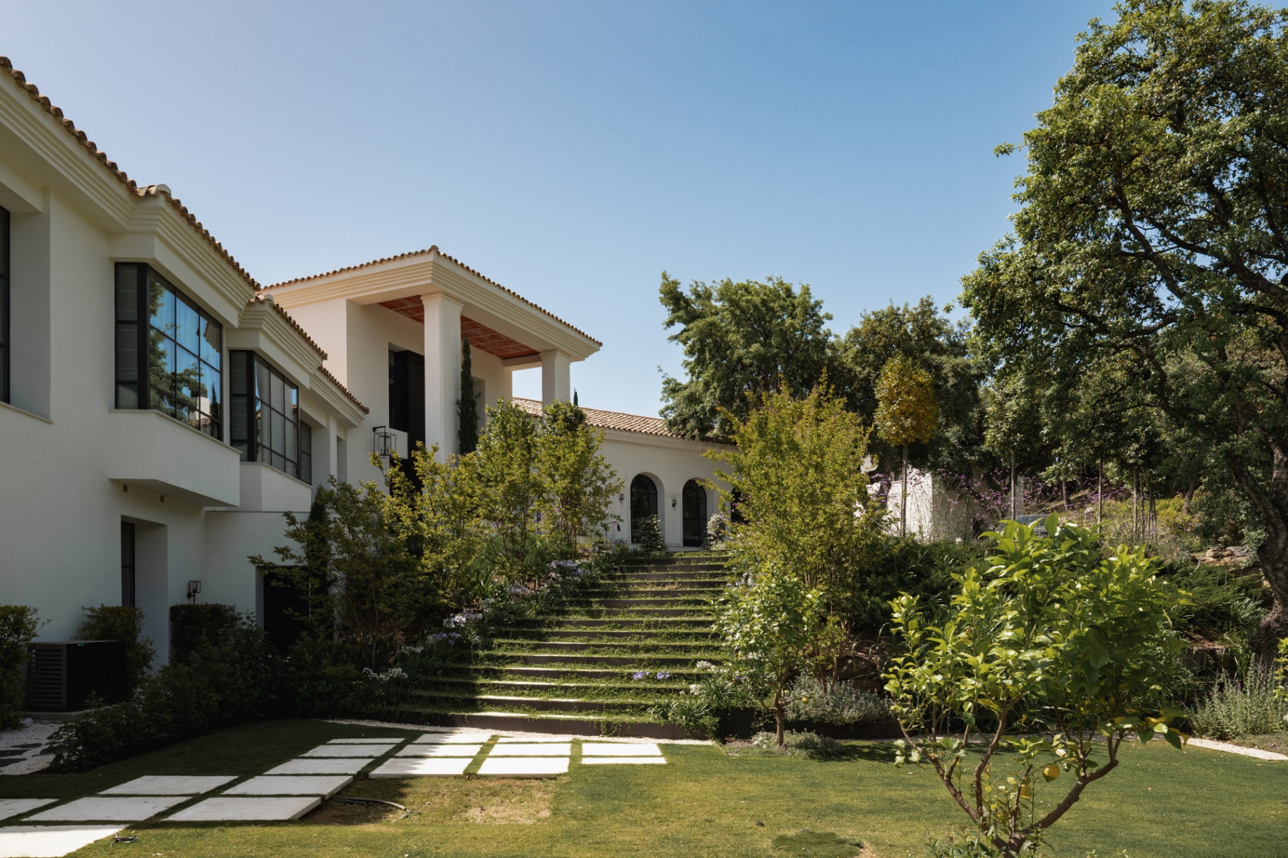 Stone steps rising through the garden toward the villa.